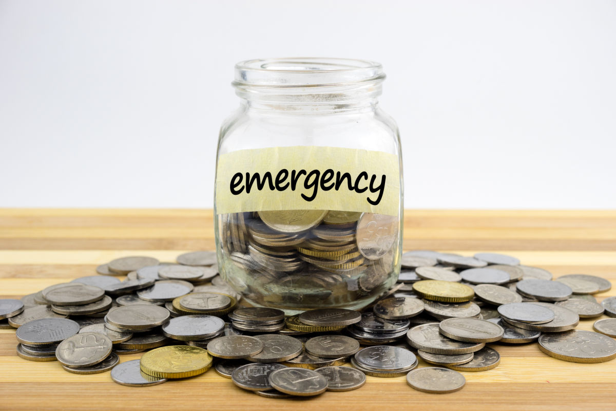 emergency fund coins in a glass jar